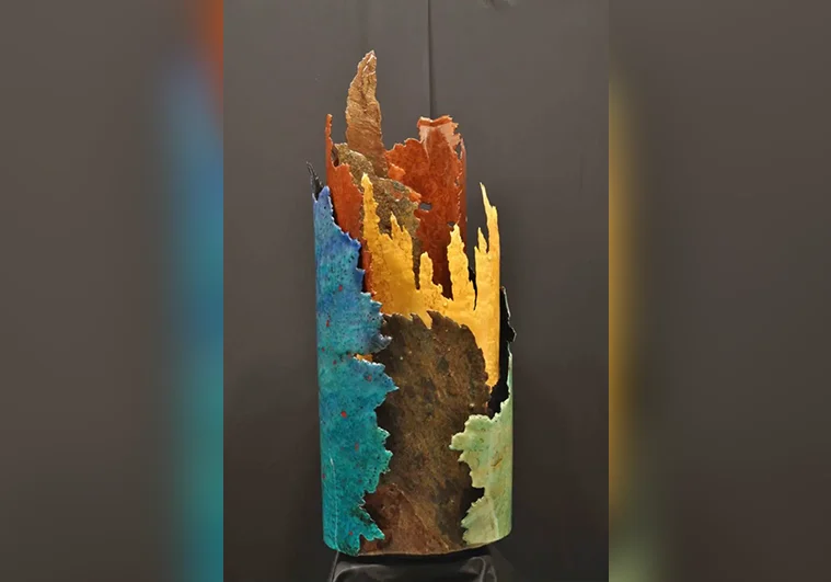 Naissance Sculpture made of wood and stone yellow blue red brown green